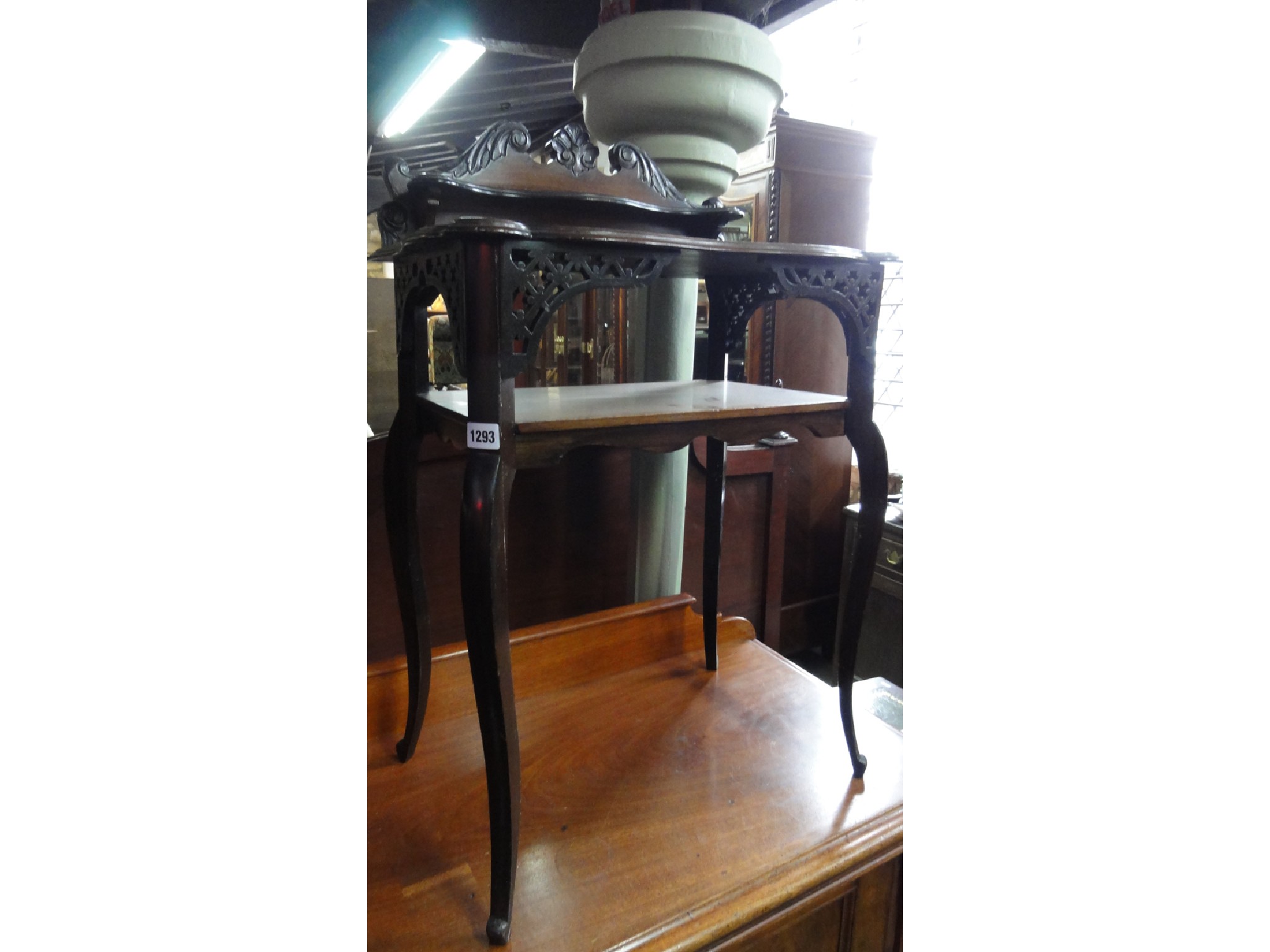 Appraisal: An Edwardian walnut side table on two tiers with shallow