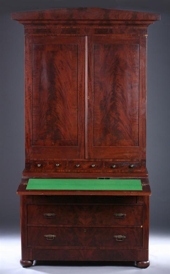 Appraisal: AMERICAN EMPIRE SECRETARY BOOKCASE th century in two parts Upper