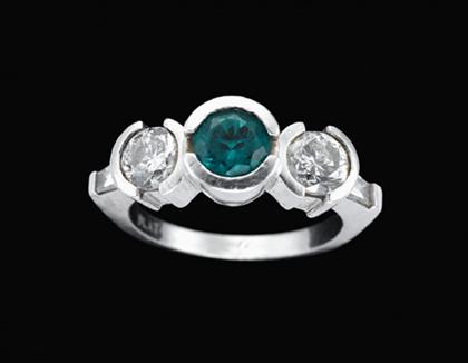 Appraisal: Platinum emerald and diamond ring Bright round cut emerald set