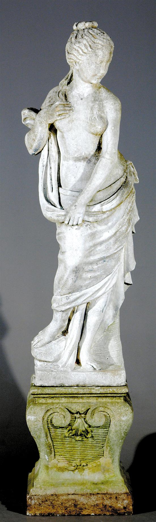 Appraisal: Cast-stone garden statue of beauty partially draped female figure on