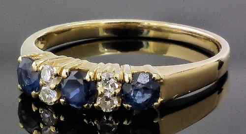 Appraisal: A modern ct gold sapphire and diamond mounted seven stone