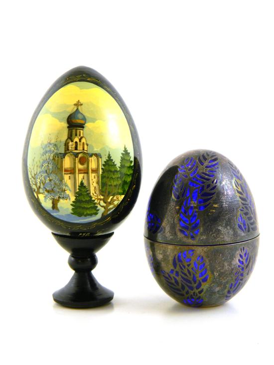 Appraisal: Two decorative eggs Russian lacquered wood egg decorated with winter