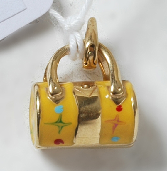 Appraisal: CT GOLD AND AND YELLOW ENAMEL HANDBAG CHARM