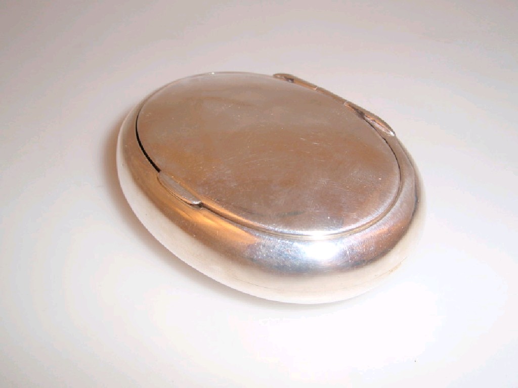 Appraisal: An Edwardian silver tobacco box of plain oval form Maker