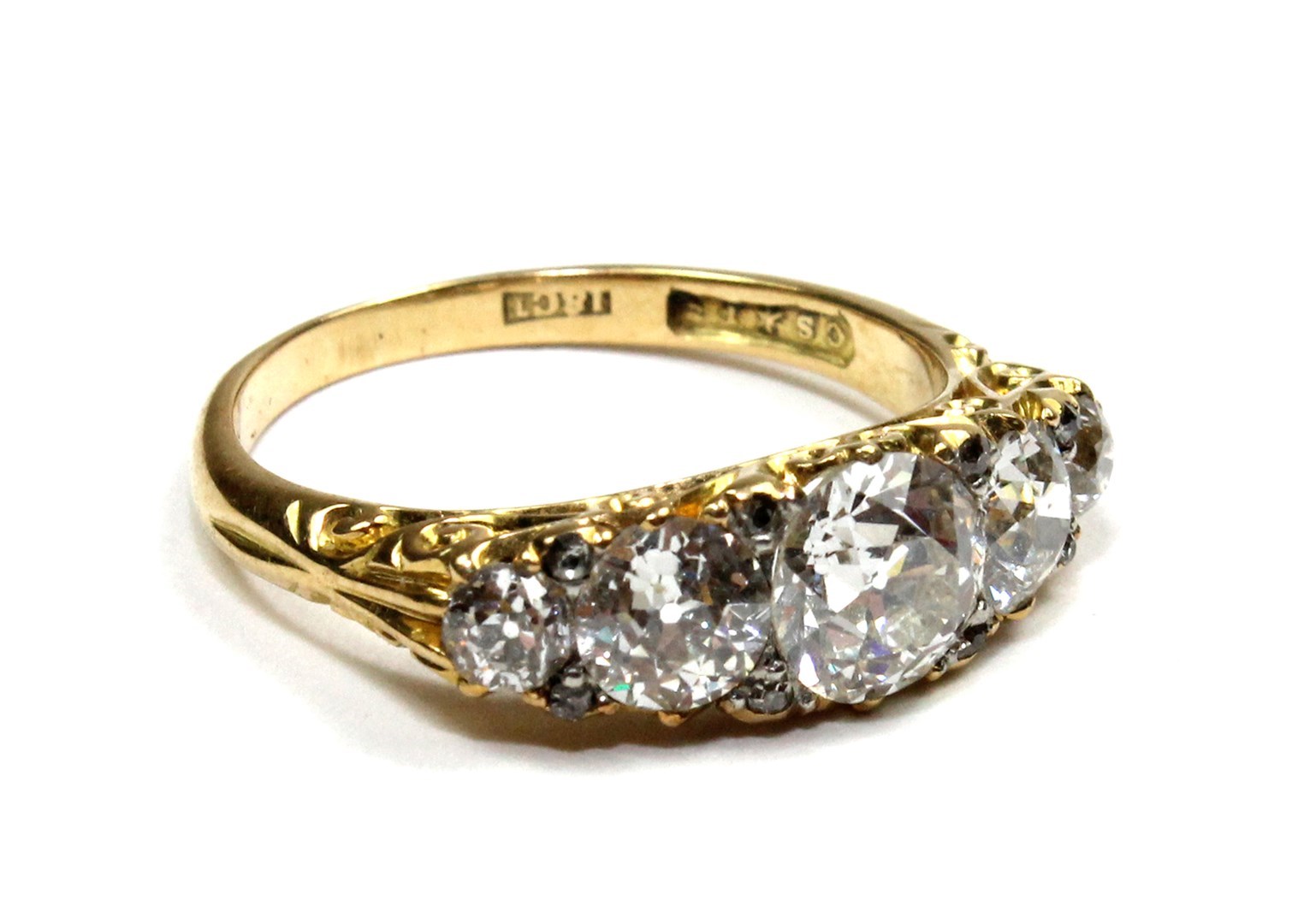 Appraisal: A gold and diamond set five stone ring mounted with