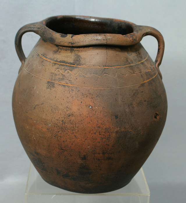 Appraisal: Redware double handled jar with incised decoration crack around one