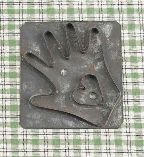 Appraisal: Tin heart in hand cookie cutter early th c x