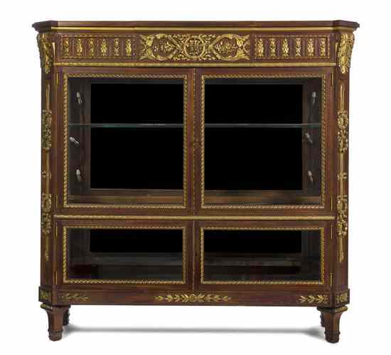 Appraisal: A Louis XVI Style Carved and Parcel Gilt Vitrine having