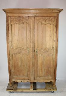 Appraisal: French Provincial natural finish carved armoire French Provincial natural finish