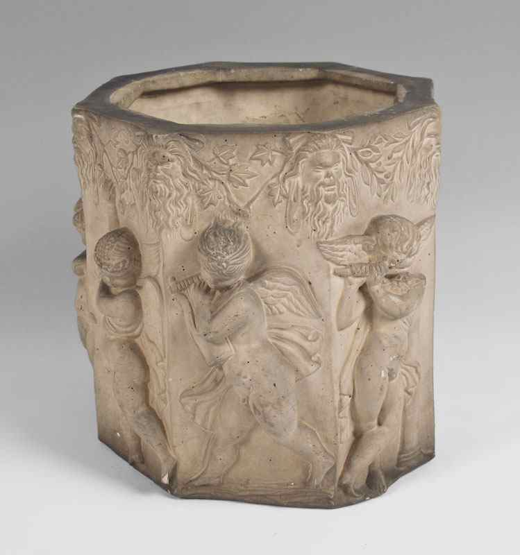 Appraisal: CHERUBIC POTTERY JARDINIER Octagon form with figural cherubs and Latin