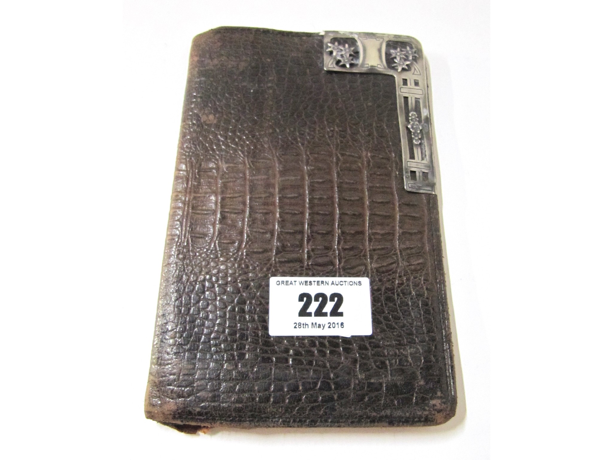 Appraisal: A silver mounted animal skin wallet with a paper bookmark