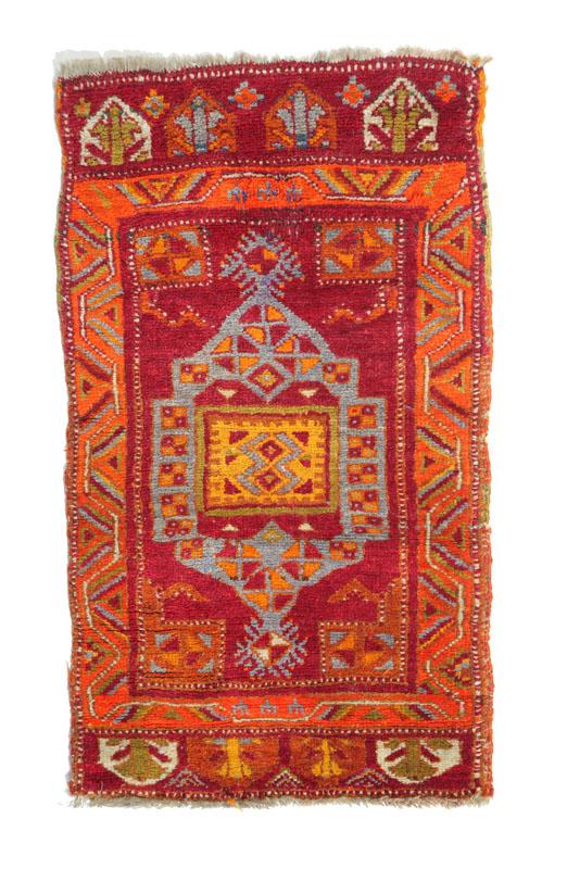 Appraisal: ORIENTAL RUG Turkish th century Red and burgundy field with