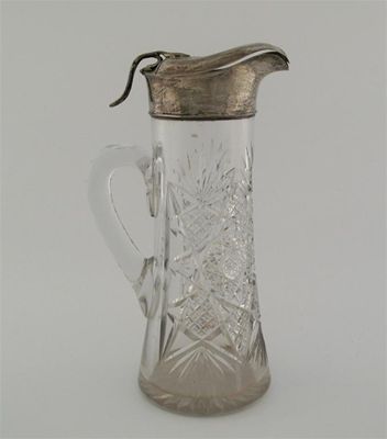 Appraisal: A modern mounted cut glass cordial jug with a star-cut