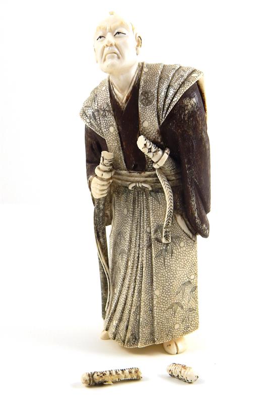 Appraisal: ASIAN Japanese ivory carving of a samurai wearing two swords