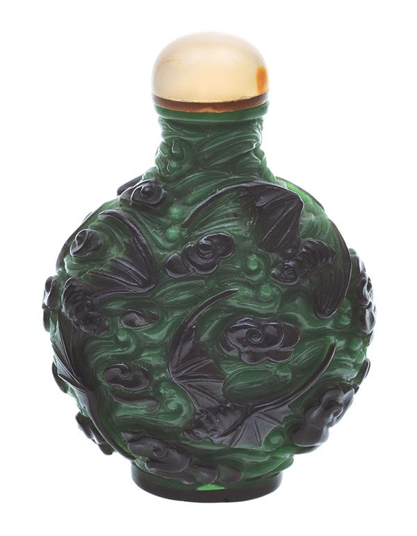 Appraisal: A BLACK GLASS OVERLAY SNUFF BOTTLE WITH QUARTZ STOPPER