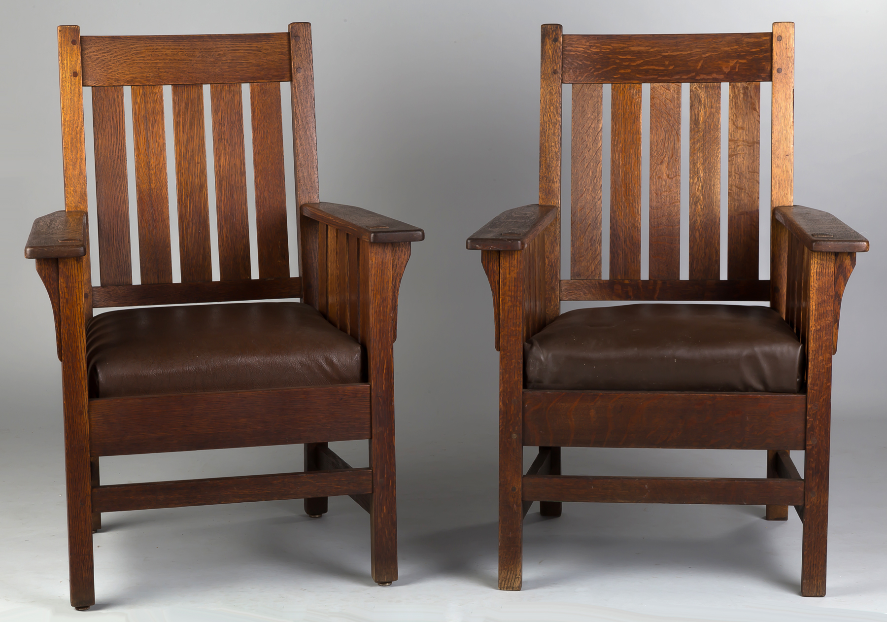 Appraisal: Arts Crafts Slatted Back Arm Chairs Early th century Quarter-sawn