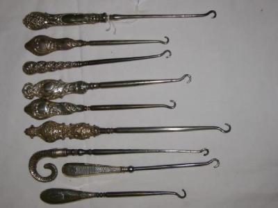 Appraisal: SIX VARIOUS BUTTON HOOKS with steel ends and embossed hafts