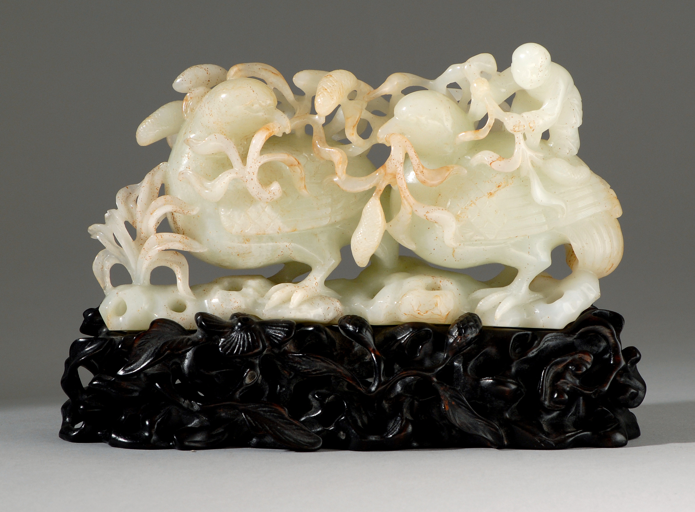 Appraisal: WHITE AND RUSSET JADE CARVING Circa In the form of