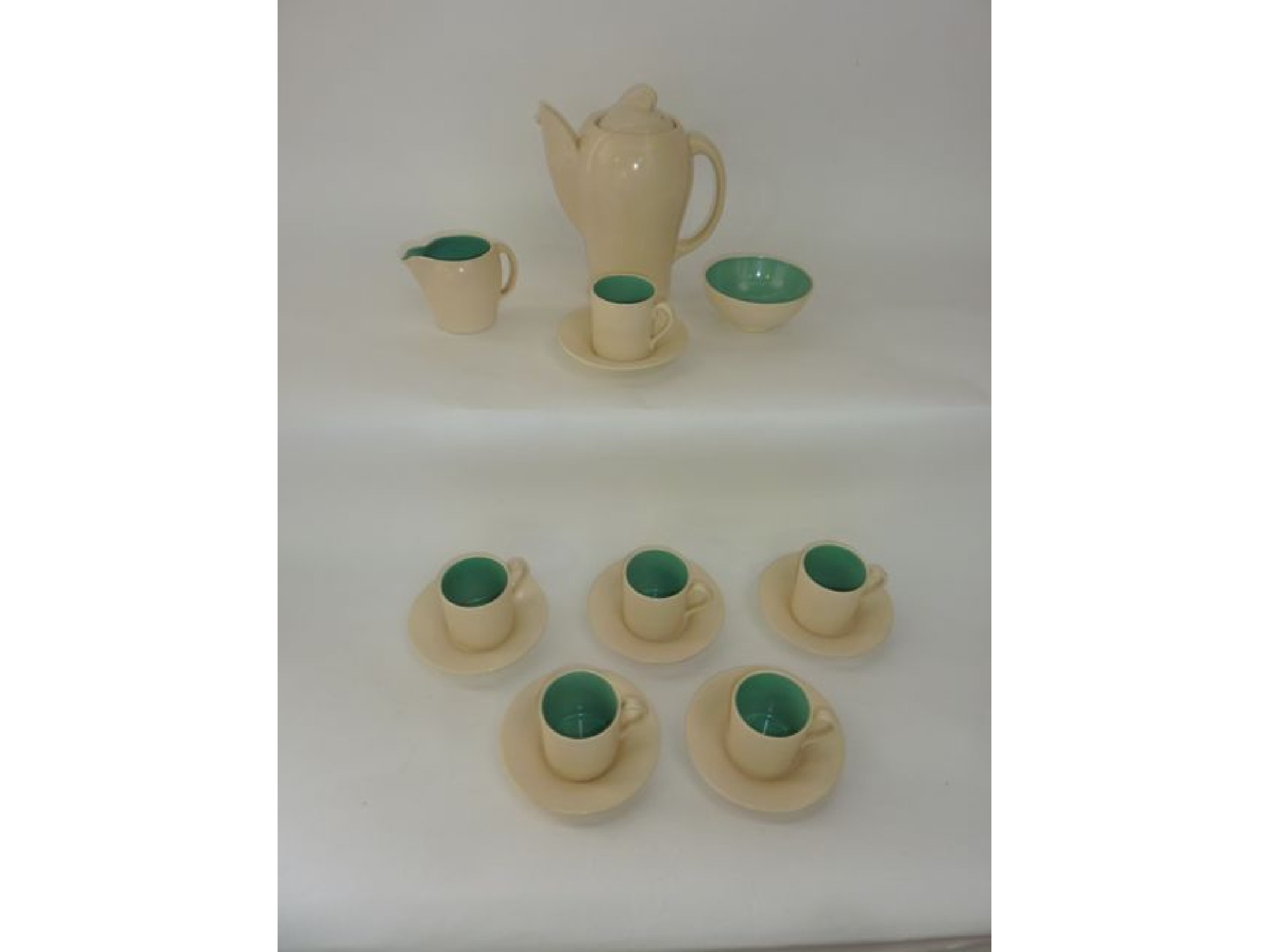 Appraisal: A Susie Cooper six place coffee service with cream glaze