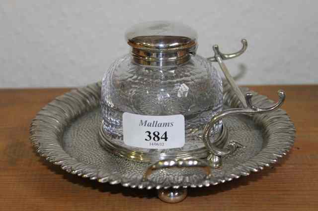 Appraisal: A GLASS INKWELL of mottle form on circular silver plated