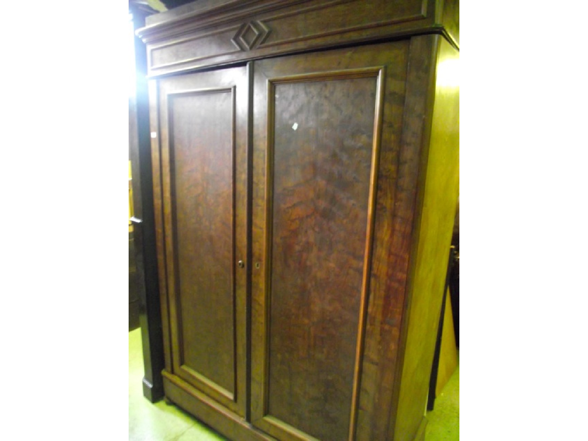 Appraisal: A th century continental plum pudding mahogany knockdown wardrobe with