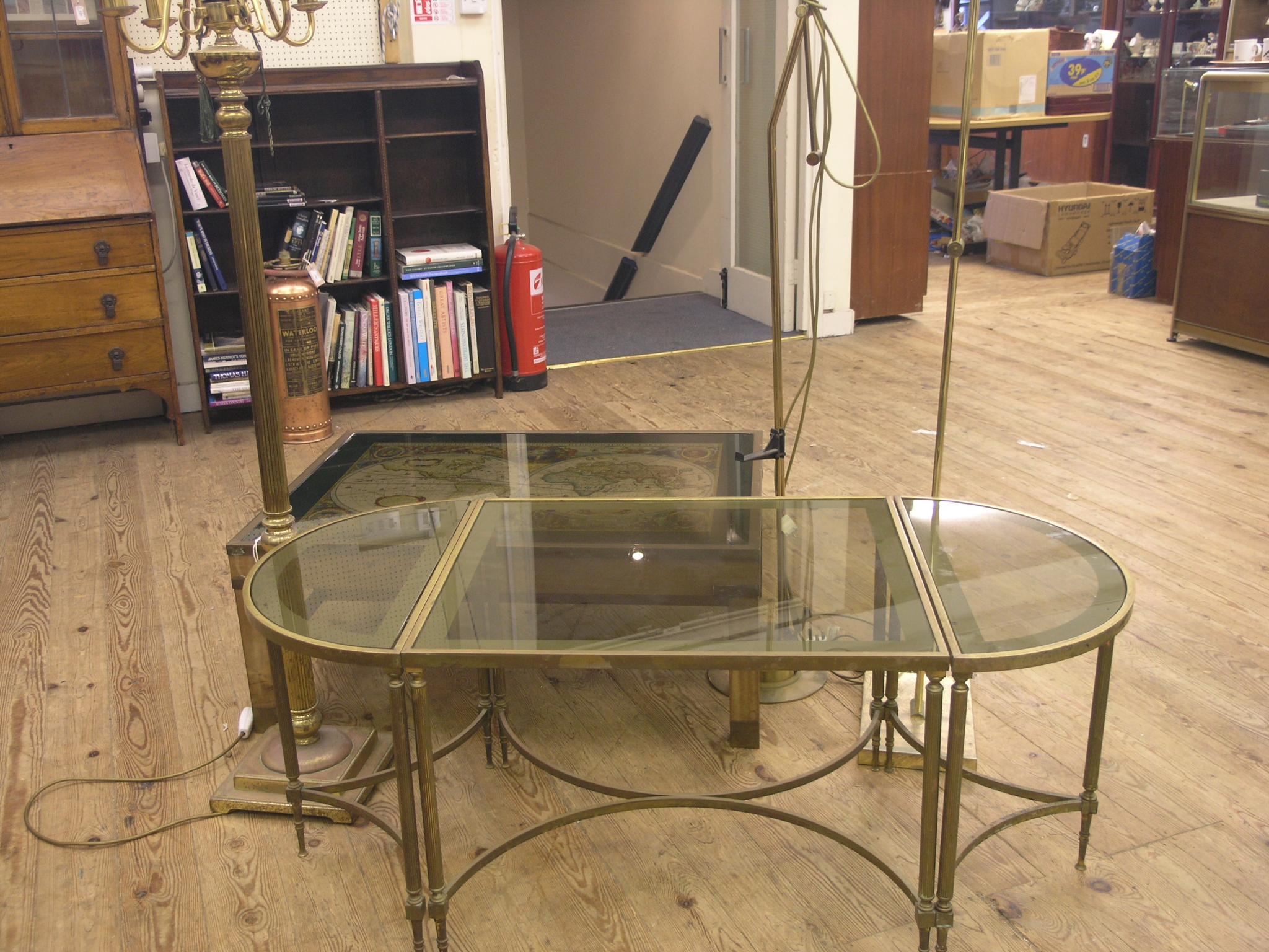 Appraisal: A brass-bound mahogany coffee table with inset atlas together with