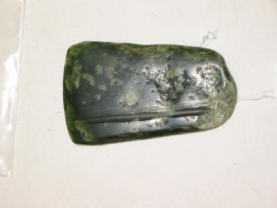 Appraisal: A NEW ZEALAND MAORI AXE BLADE in pounamu or nephrite