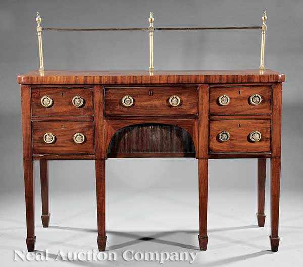 Appraisal: A Georgian Carved Mahogany Sideboard c top with brass gallery