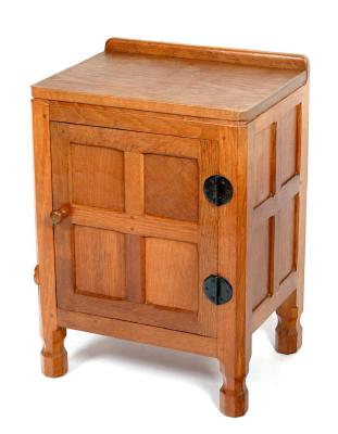 Appraisal: AN ADZED OAK BEDSIDE CABINET by Robert Mouseman Thompson of