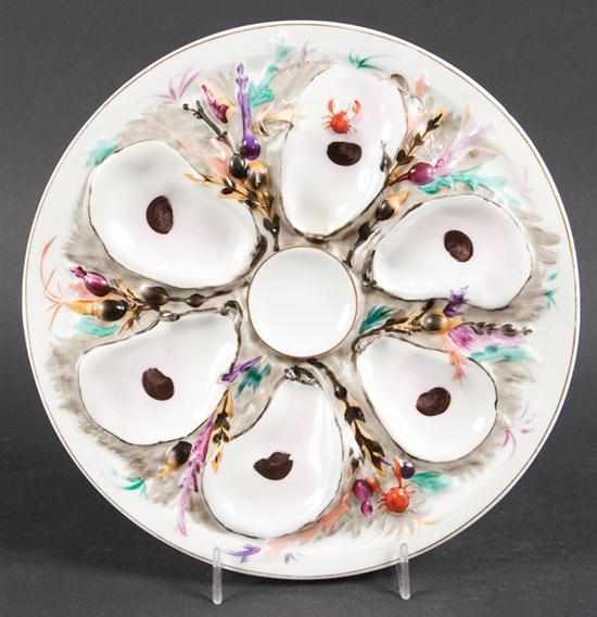 Appraisal: American painted porcelain oyster plate molded seaweed and crab decoration