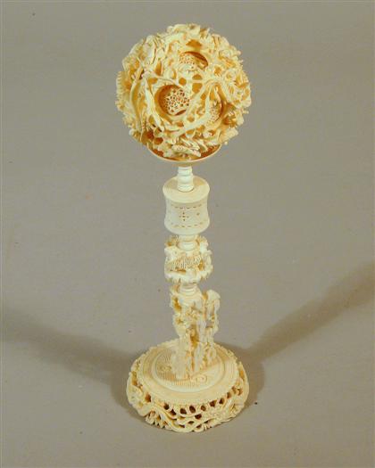 Appraisal: Chinese elephant ivory games ball on stand Typical multi-ball sphere