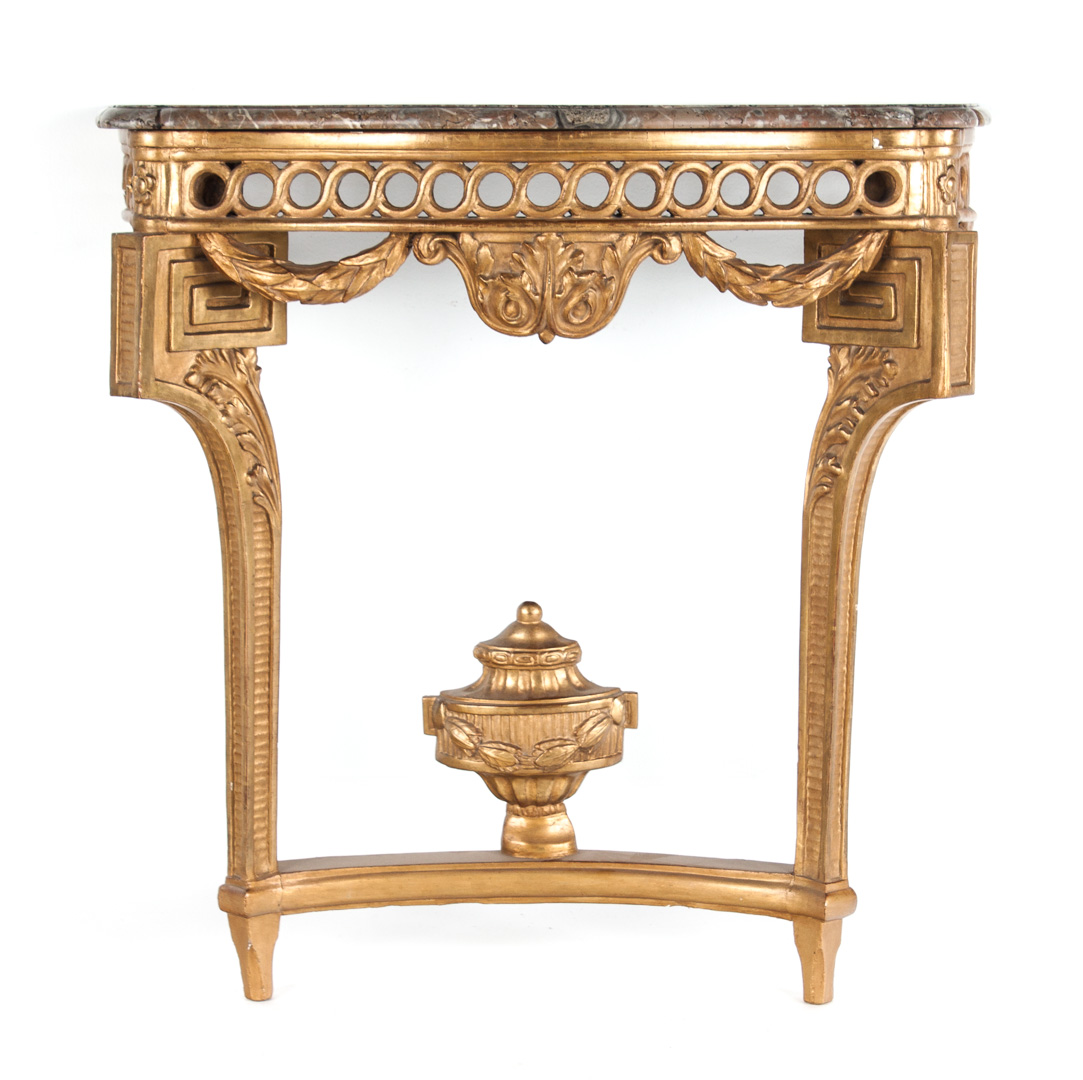 Appraisal: a Louis XIV style carved giltwood console Shaped brown and