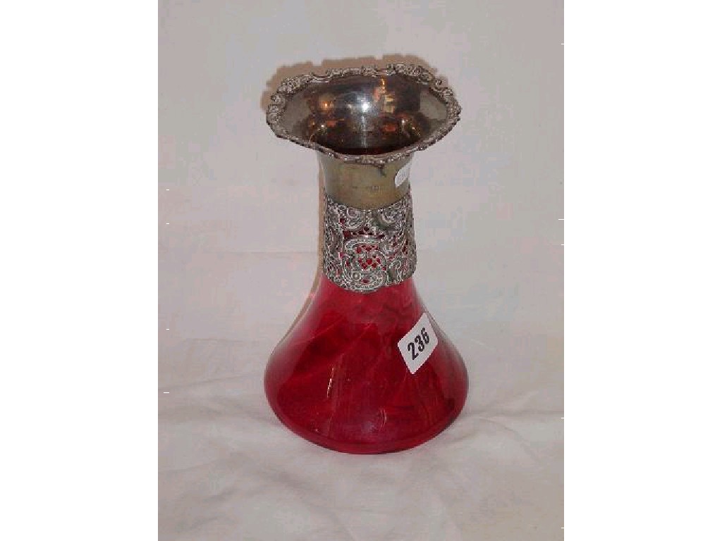 Appraisal: A th century cranberry glass vase of wrythen moulded form