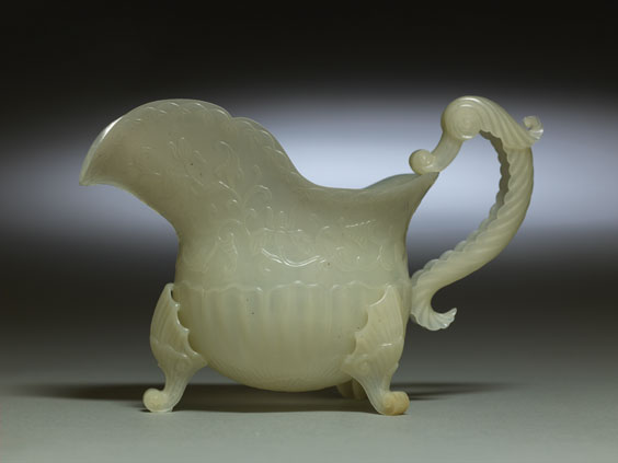 Appraisal: CHINESE CARVED JADE EWER Remarkably thinly carved Chinese Moghul-style celadon