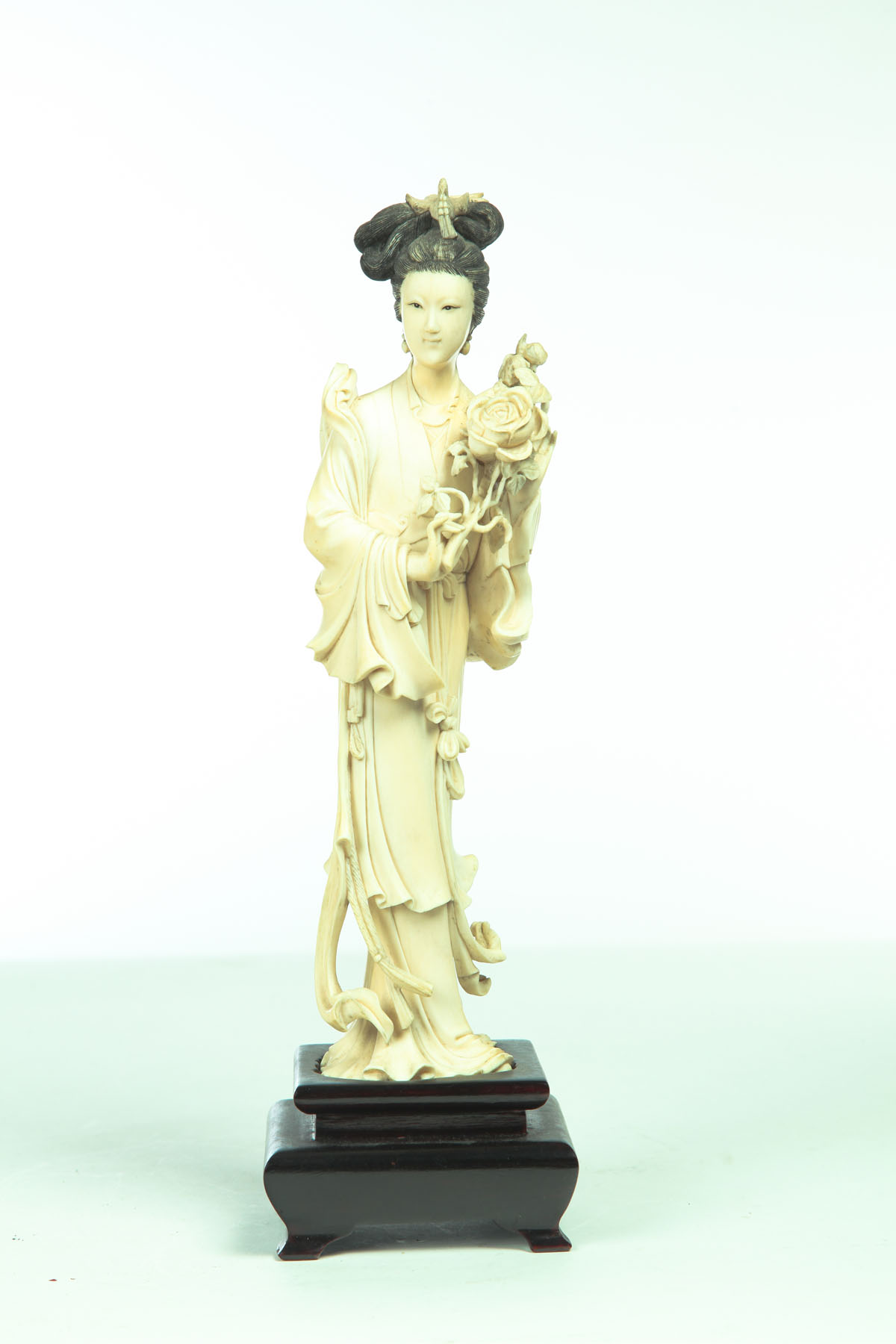 Appraisal: IVORY CARVING OF A WOMAN Japan th century Delicately carved