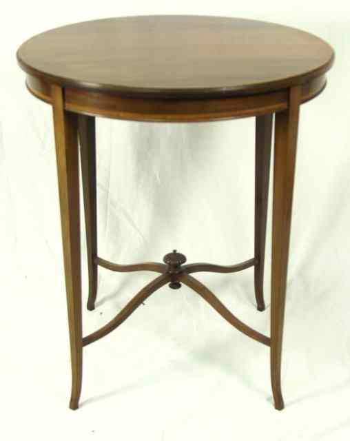 Appraisal: An Edwardian mahogany circular table on square taper legs with