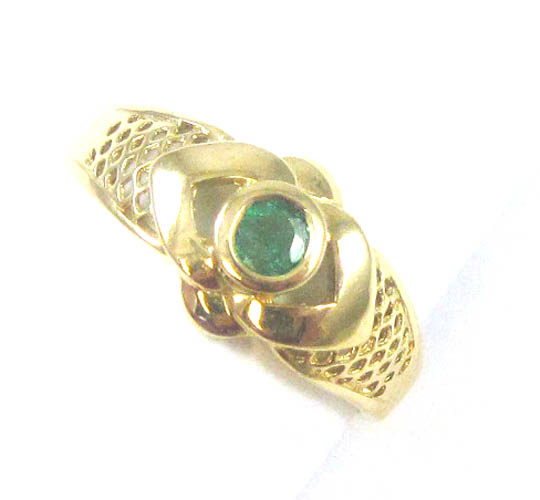 Appraisal: EMERALD DIAMOND AND FOURTEEN KARAT GOLD RING with a bezel