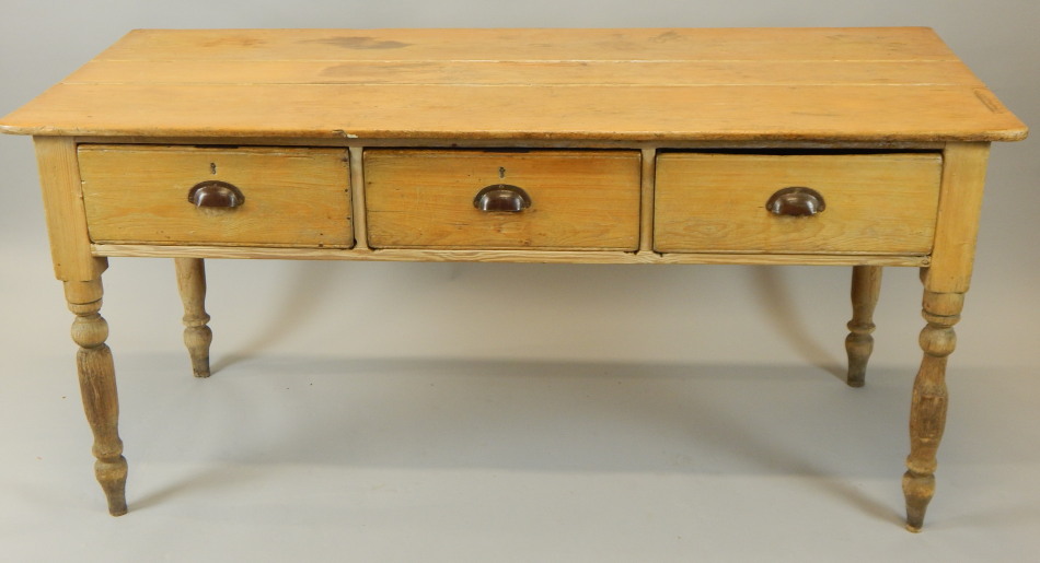 Appraisal: A Victorian stripped pine dairy table with a plank top