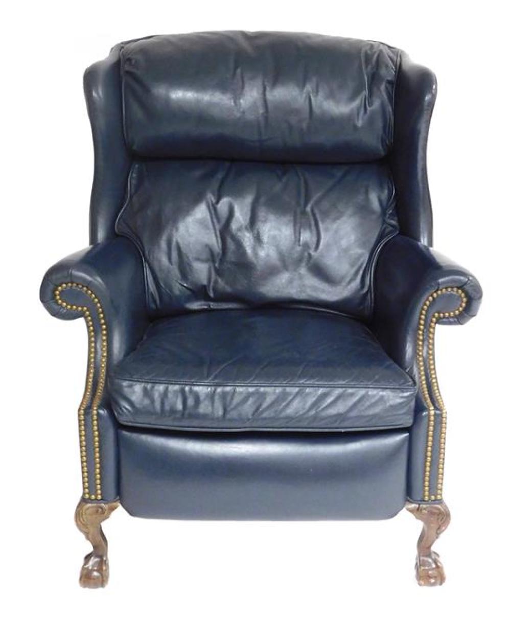 Appraisal: Leather wing chair Chippendale style reclines blue-grey leather with brass