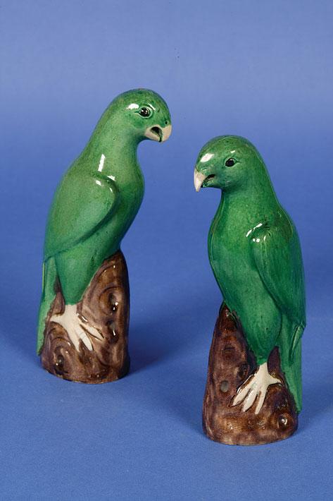 Appraisal: A PAIR OF CHINESE EXPORT BISCUIT FIGURES OF PARROTS perched