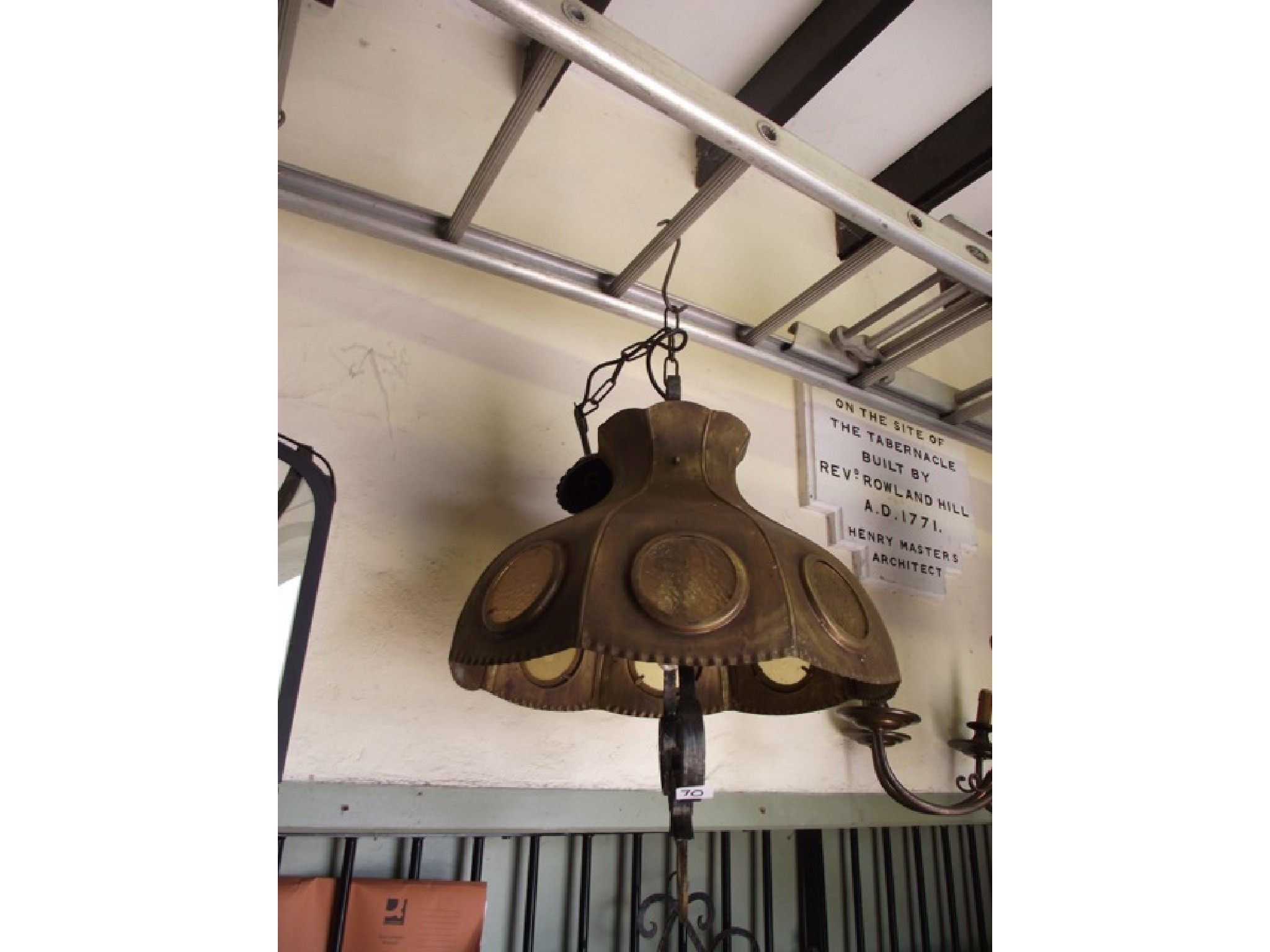 Appraisal: An unusual hanging ceiling light the scroll work stem supporting