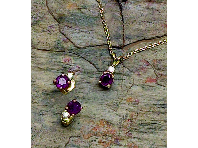 Appraisal: RUBY PENDANT AND EARRING SET k yellow gold pendant and