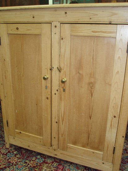 Appraisal: A pine two-door cupboard cm wide