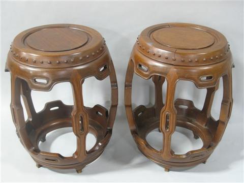 Appraisal: PAIR OF CHINESE HARDWOOD STOOLS Of barrel form and carved