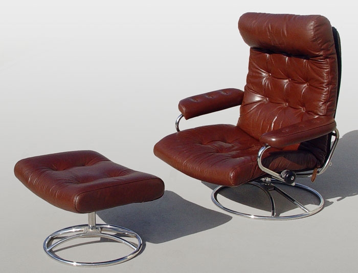 Appraisal: MODERN RECLINING LEATHER CHAIR WITH OTTOMAN Chair measures approx ''