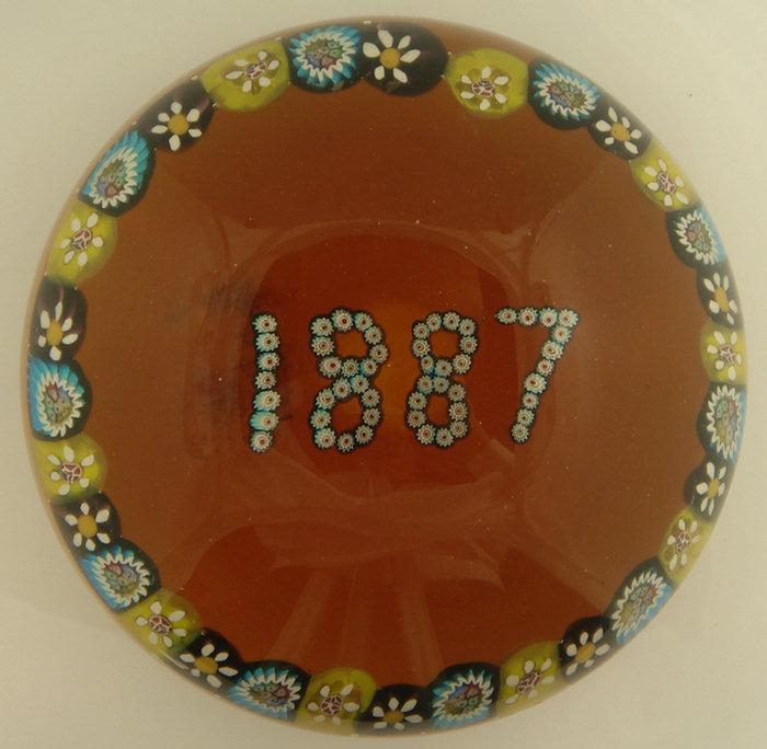 Appraisal: Amber blown glass paperweight with millifiori border and date of