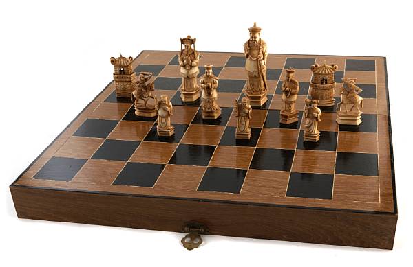 Appraisal: A carved ivory chess set with wash decoration The chief