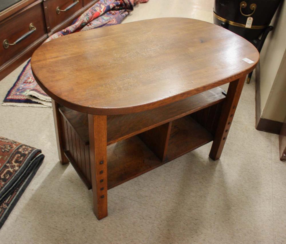 Appraisal: OVAL CRAFTSMAN OAK CENTER TABLE American c three-tier design with