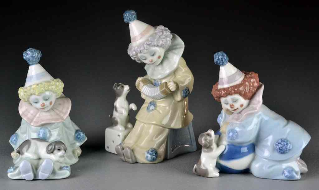 Appraisal: Lladro Porcelain Clown FigurinesTo include depicting a clown with puppy