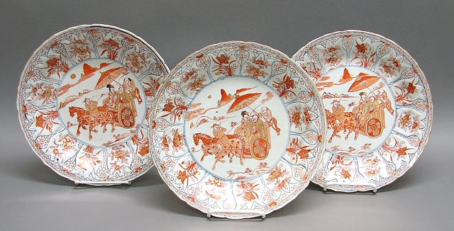 Appraisal: Center with horse-drawn cart with attendants gilt iron red conforming